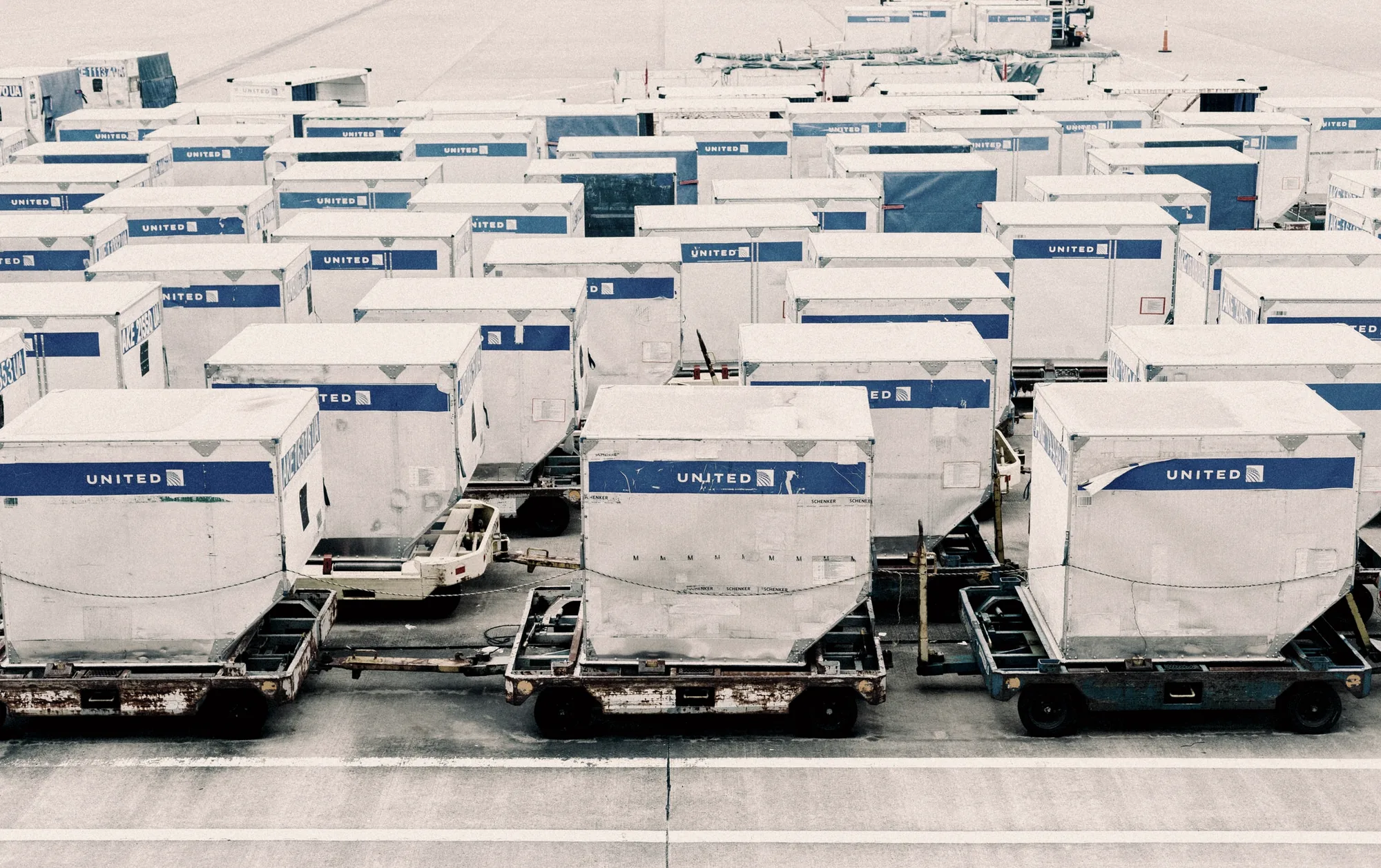 Air cargo containers staged on an airport ramp